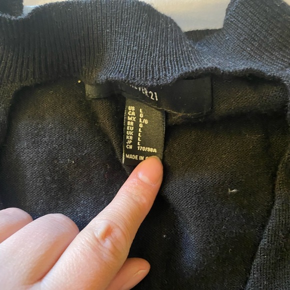 This is a black knit crop top with a key hole front. - Picture 3 of 3